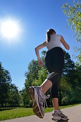 Image showing Young beautiful  woman jogging at morning in park