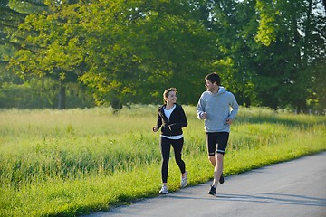 Image showing Young couple jogging