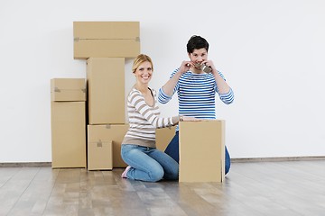 Image showing Young couple moving in new house