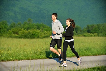 Image showing Young couple jogging