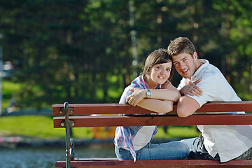 Image showing Portrait of romantic young couple smiling together outdoor