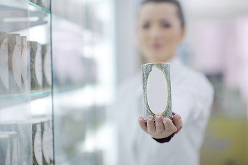 Image showing pharmacist chemist woman standing in pharmacy drugstore