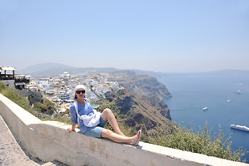 Image showing Greek woman on the streets of Oia, Santorini, Greece