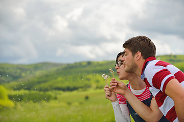 Image showing Portrait of romantic young couple smiling together outdoor