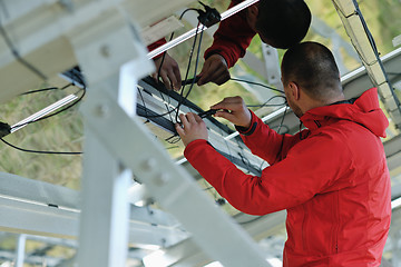 Image showing Male solar panel engineer at work place