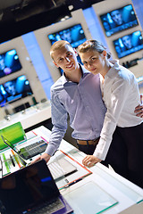 Image showing Young couple in consumer electronics store