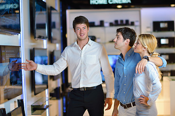 Image showing Young couple in consumer electronics store