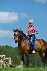 Image showing happy woman  on  horse