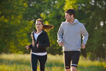 Image showing Young couple jogging