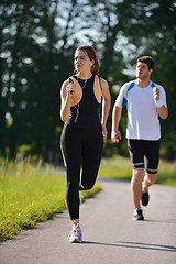 Image showing Young couple jogging