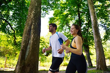 Image showing Young couple jogging