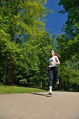 Image showing Young beautiful  woman jogging at morning in park