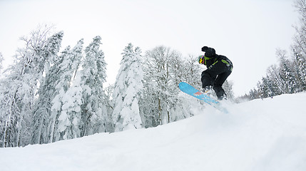 Image showing snowboarder on fresh deep snow
