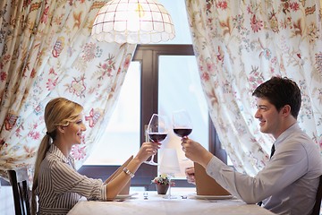 Image showing young couple having dinner at a restaurant