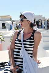 Image showing Greek woman on the streets of Oia, Santorini, Greece