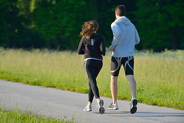 Image showing Young couple jogging