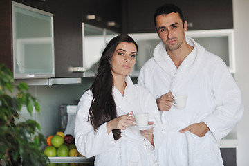 Image showing Young love couple taking fresh morning cup of coffee