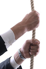 Image showing business man with rope isolated on white background