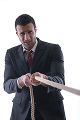 Image showing business man with rope isolated on white background