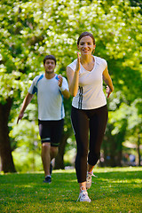 Image showing Young couple jogging