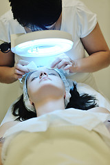 Image showing woman with facial mask in cosmetic studio