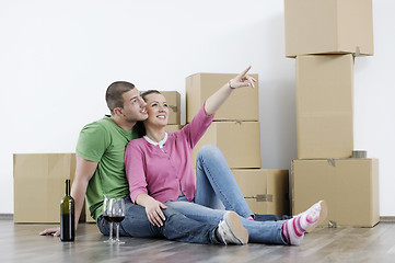 Image showing Young couple moving in new home