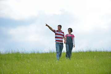 Image showing Portrait of romantic young couple smiling together outdoor