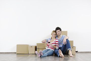 Image showing Young couple moving in new home