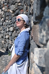 Image showing Greek woman on the streets of Oia, Santorini, Greece