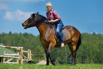 Image showing happy woman  on  horse