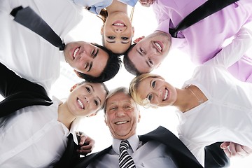 Image showing business people with their heads together