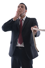 Image showing business man with rope isolated on white background