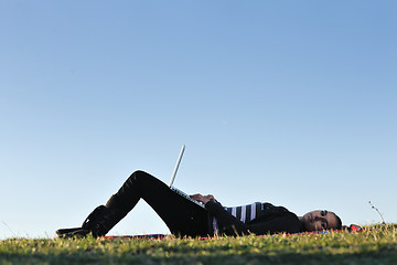 Image showing young teen girl work on laptop outdoor