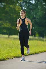 Image showing Young couple jogging at morning