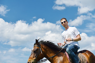 Image showing man ride horse