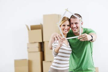 Image showing Young couple moving in new house