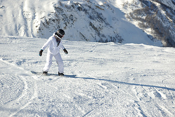 Image showing skiing on fresh snow at winter season at beautiful sunny day