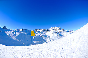 Image showing Sign board at High mountains under snow in the winter