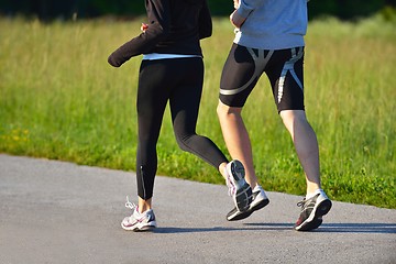 Image showing Young couple jogging