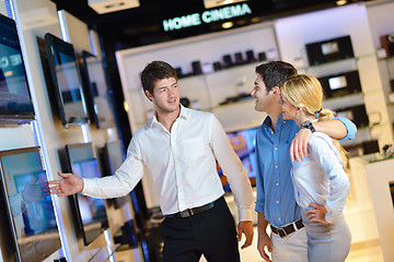 Image showing Young couple in consumer electronics store