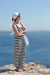 Image showing Greek woman on the streets of Oia, Santorini, Greece