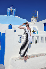 Image showing Greek woman on the streets of Oia, Santorini, Greece