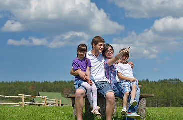 Image showing happy young family have fun outdoors