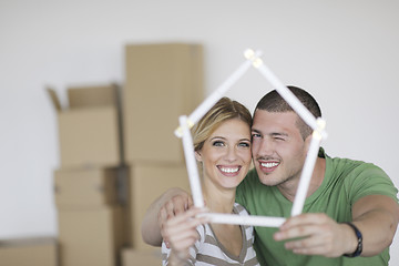 Image showing Young couple moving in new home