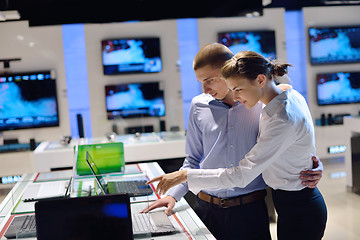 Image showing Young couple in consumer electronics store