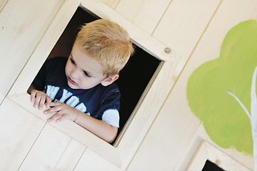 Image showing happy child in a window