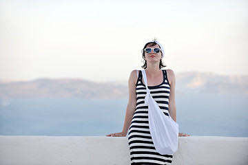 Image showing Greek woman on the streets of Oia, Santorini, Greece