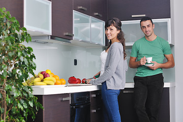 Image showing young couple have fun in modern kitchen