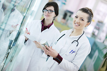 Image showing team of pharmacist chemist woman  in pharmacy drugstore