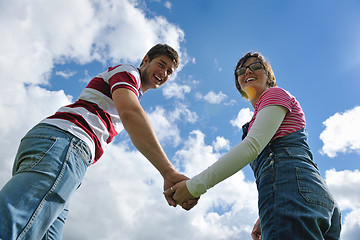 Image showing Portrait of romantic young couple smiling together outdoor